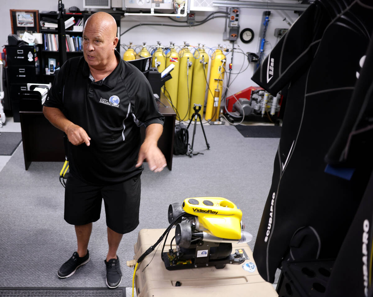 Technical diver Steve Schafer shows an underwater remote-operated vehicle at his Henderson home ...