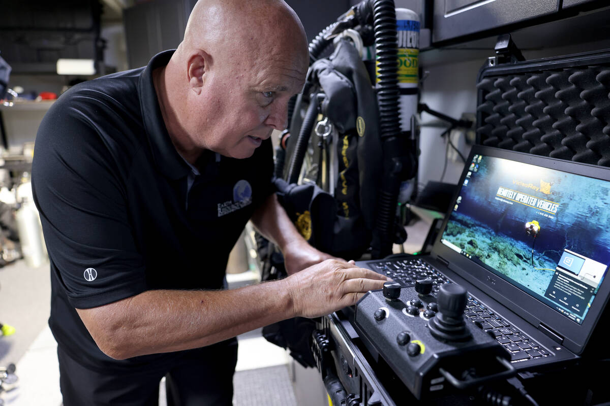 Technical diver Steve Schafer shows how he uses an underwater remote-operated vehicle at his He ...