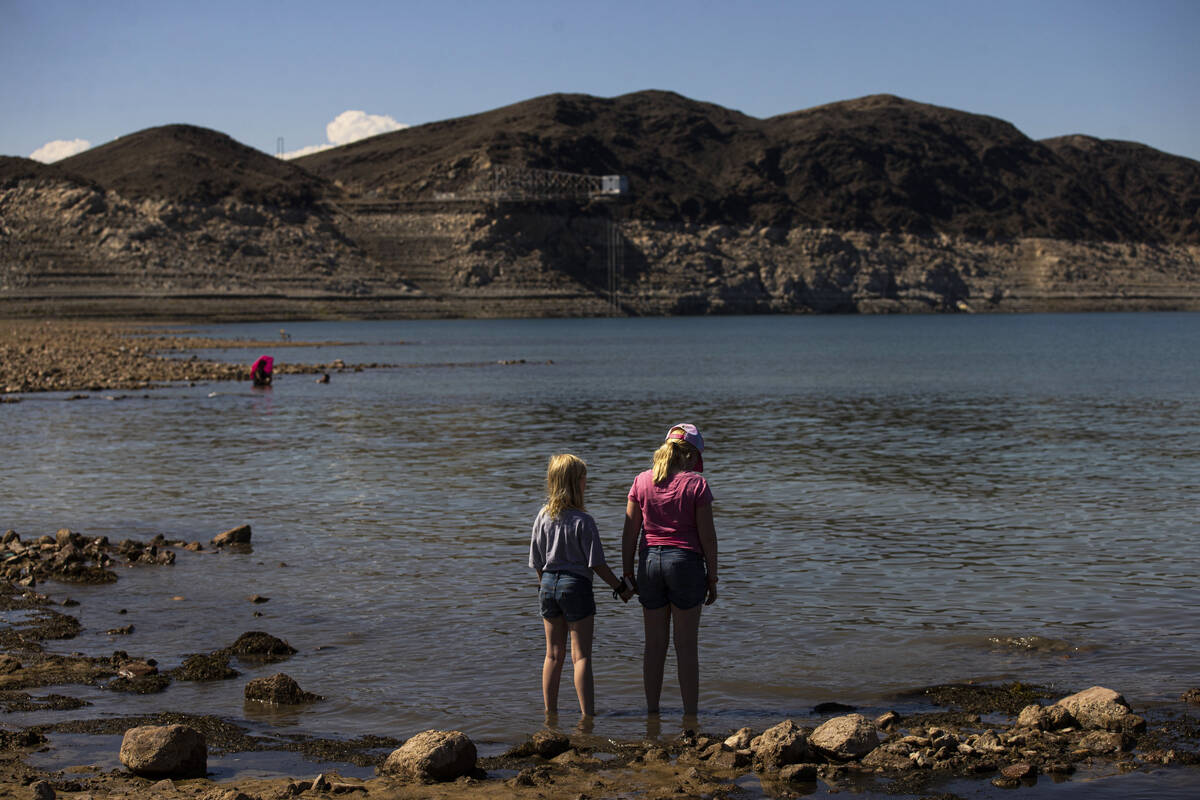 A pair of girls look out at Swim Beach at Lake Mead National Recreation Area, the day after hum ...