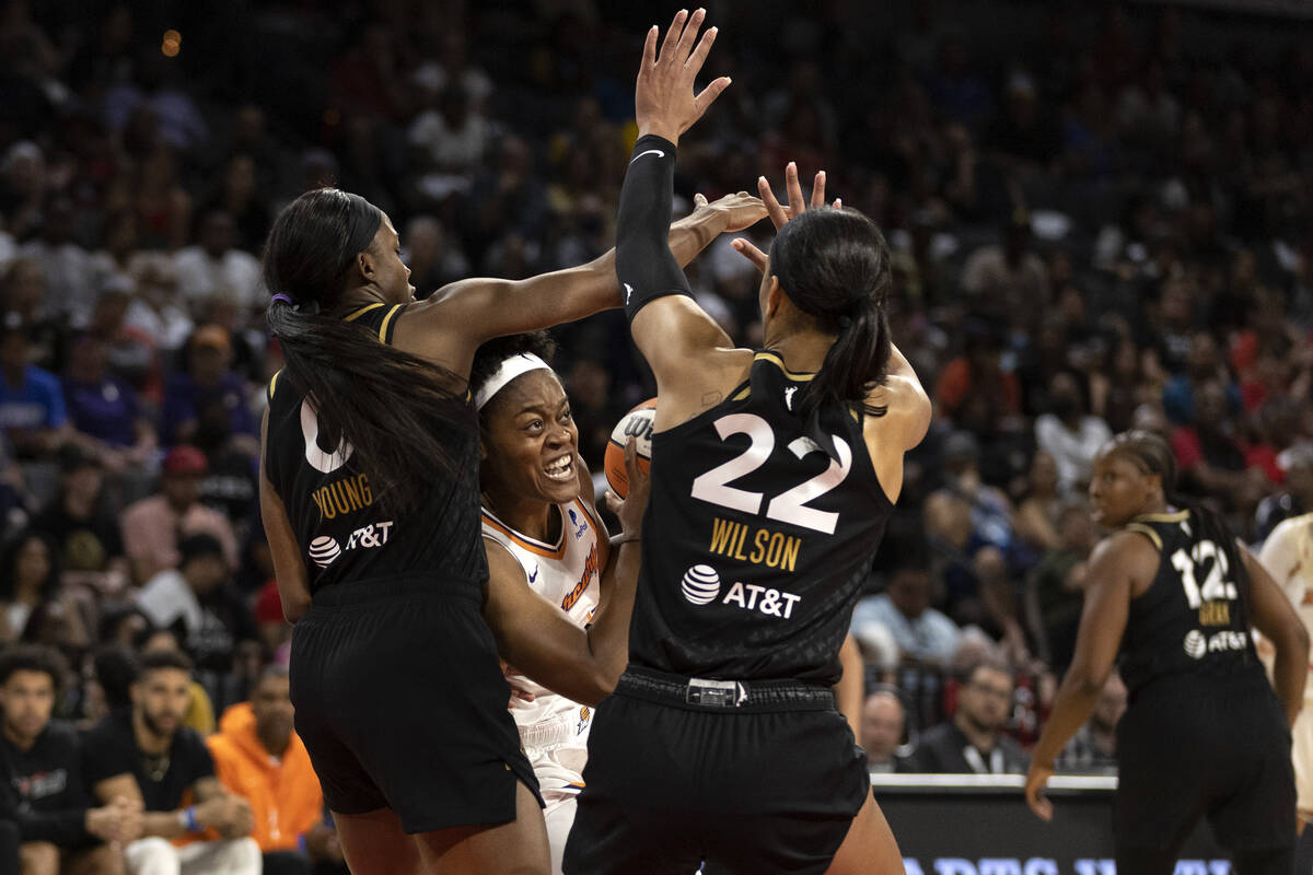 Phoenix Mercury forward Kaela Davis (3) shoots against Las Vegas Aces guard Jackie Young (0) an ...