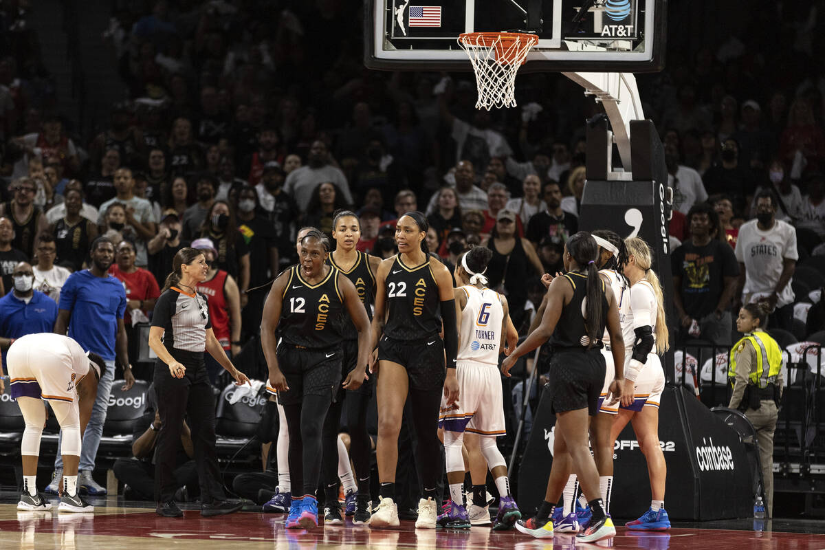 Las Vegas Aces guard Chelsea Gray (12) and forward A'ja Wilson (22) react after being fouled by ...