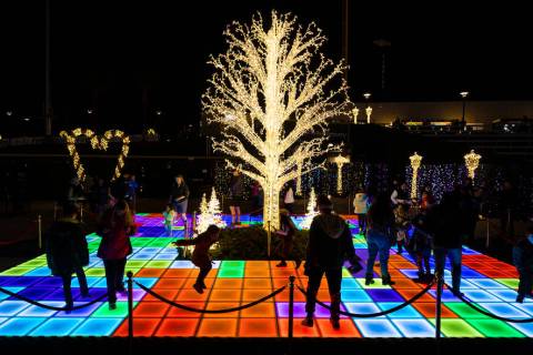 Attendees explore Enchant Christmas at Las Vegas Ballpark on Tuesday, Nov. 30, 2021, in Las Veg ...