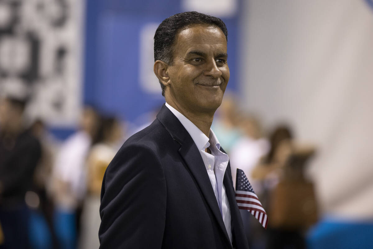Mohammed Albuhadla, originally from Iraq, prepares to become a U.S. citizen before a naturaliza ...