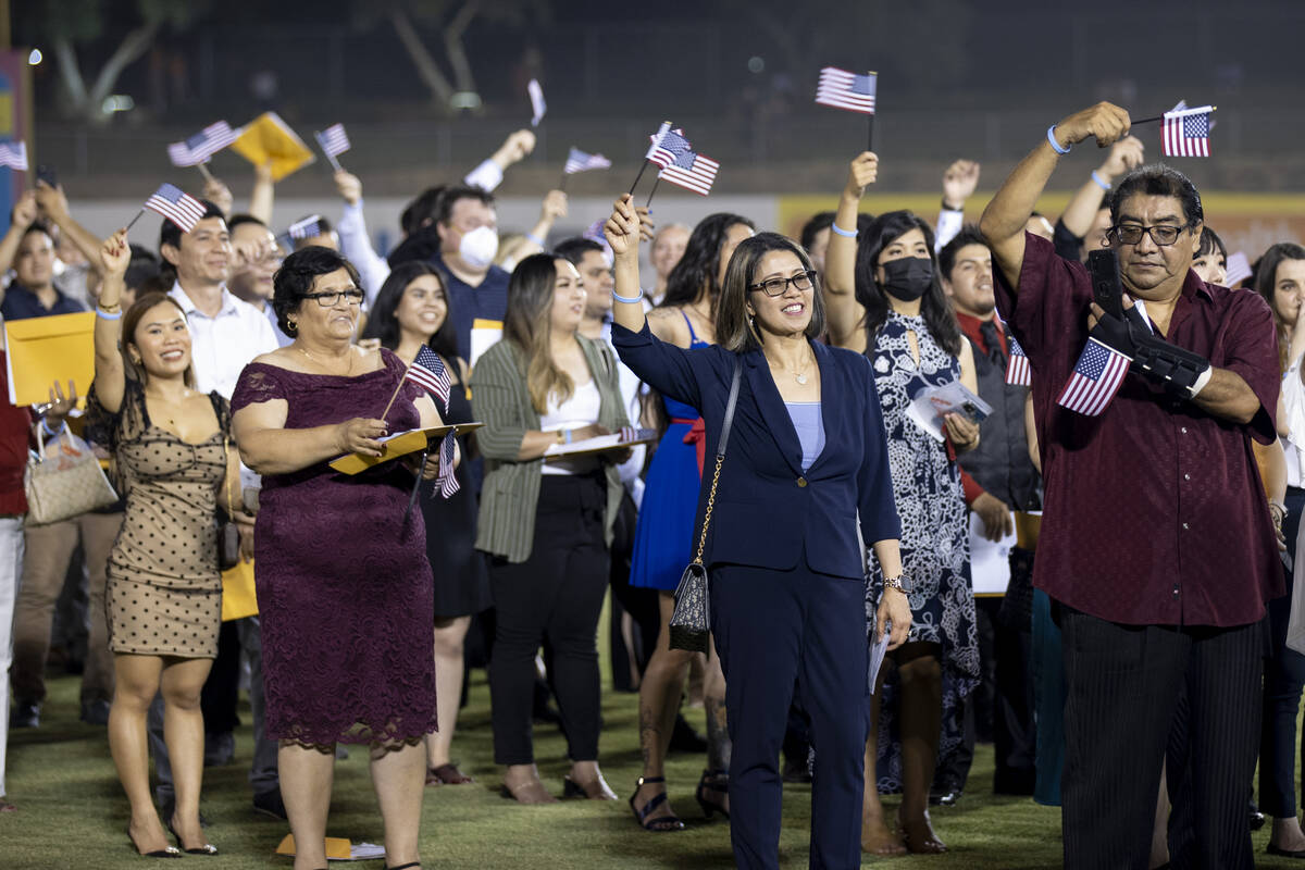 About 700 people become U.S. citizens during a naturalization ceremony at halftime of the Las V ...