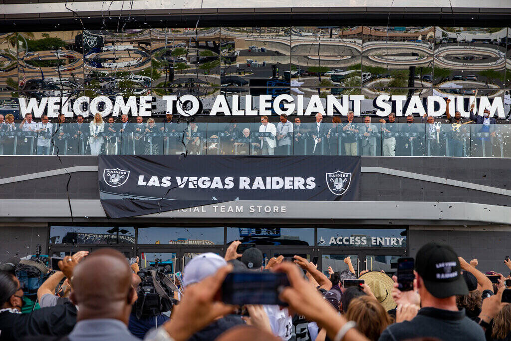 Invited dignitaries join Raiders owner Mark Davis before fans during the official ribbon-cuttin ...