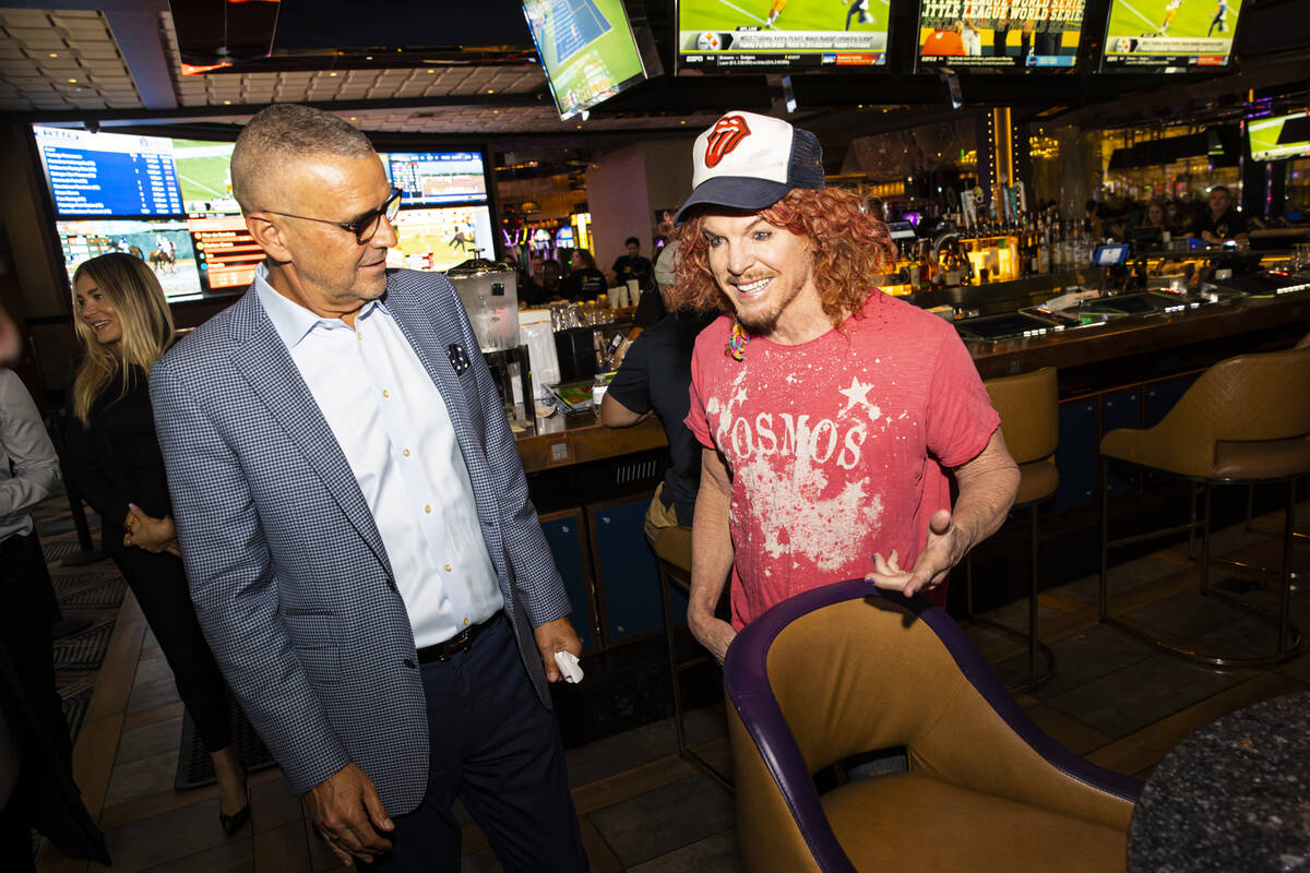 Carrot Top, right, chats with Anton Nikodemus, president and chief operating officer of The Cos ...