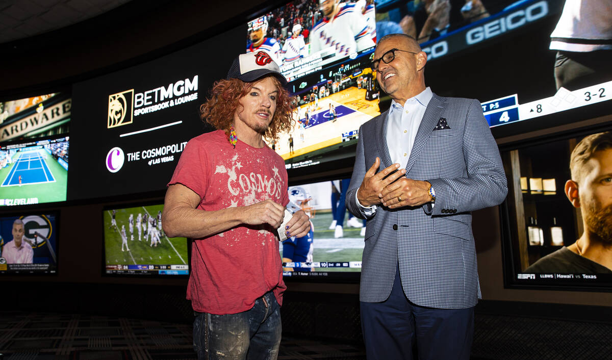 Carrot Top, left, chats with Anton Nikodemus, president and chief operating officer of The Cosm ...
