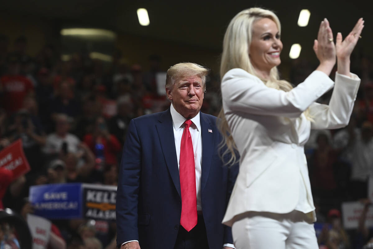 U.S. Senate candidate Kelly Tshibaka, right, applauds as she is joined by former President Dona ...