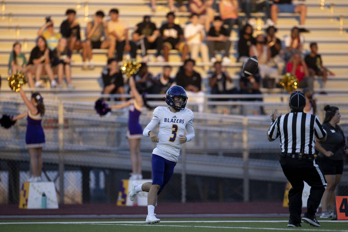 Durango quarterback Maverik Cormier (3) tosses the ball to a referee after catching the kick of ...