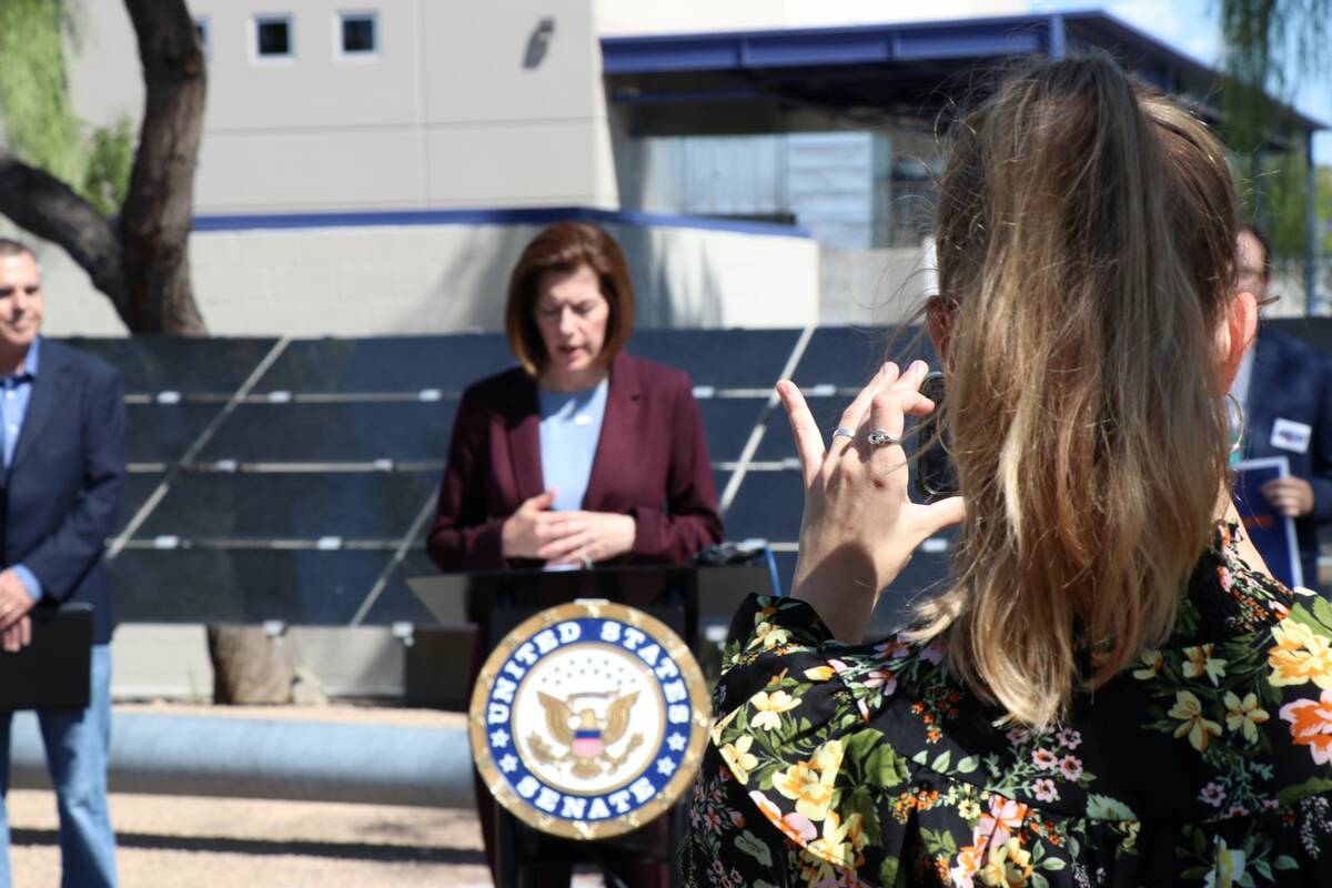 A staffer for Sen. Catherine Cortez Masto films the senator as she touts the clean energy benef ...