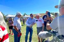 Republican U.S. Senate nominee Adam Laxalt, center left, takes pictures with supporters at the ...