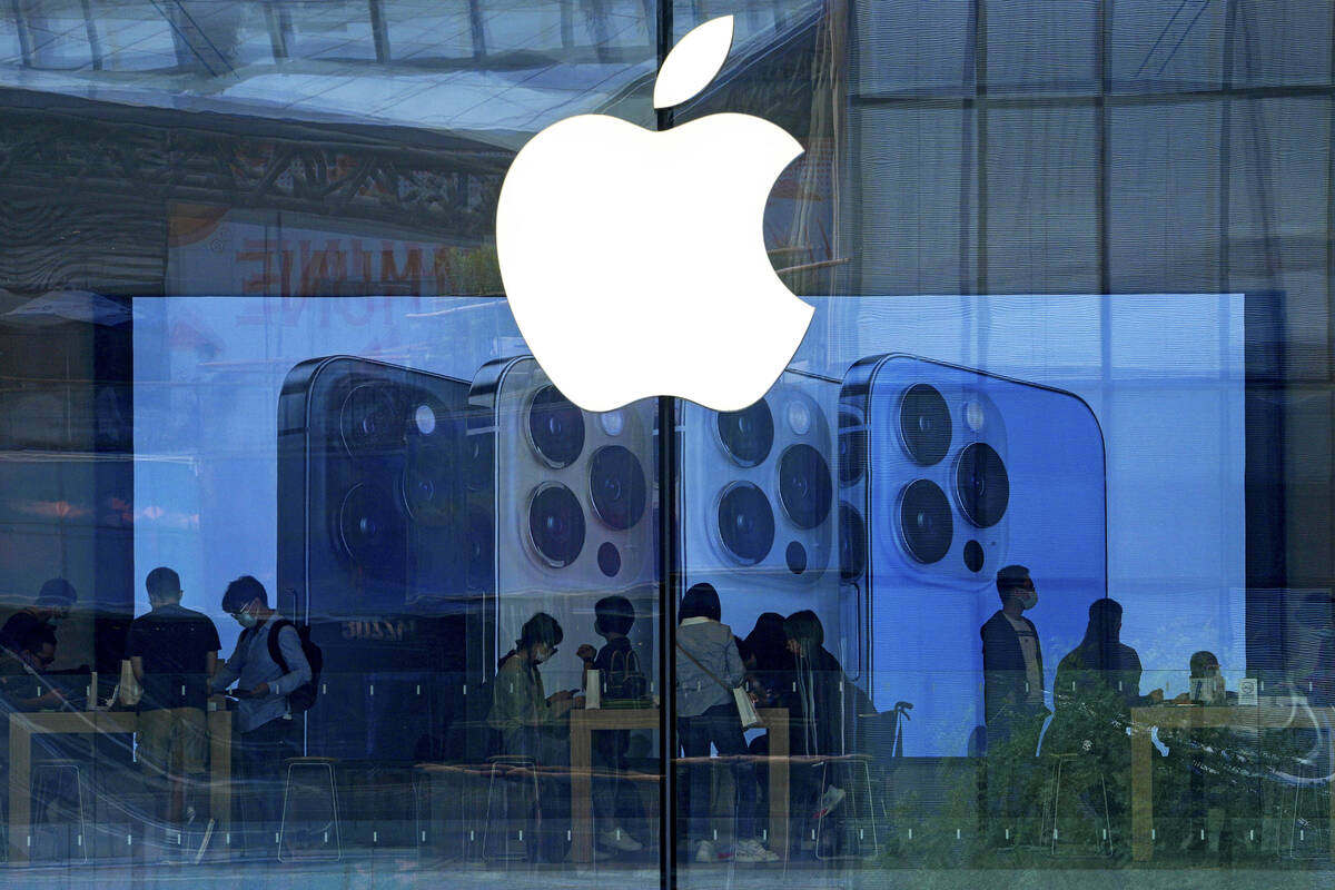 FILE - People shop at an Apple Store in Beijing, Tuesday, Sept. 28, 2021. Apple's latest securi ...