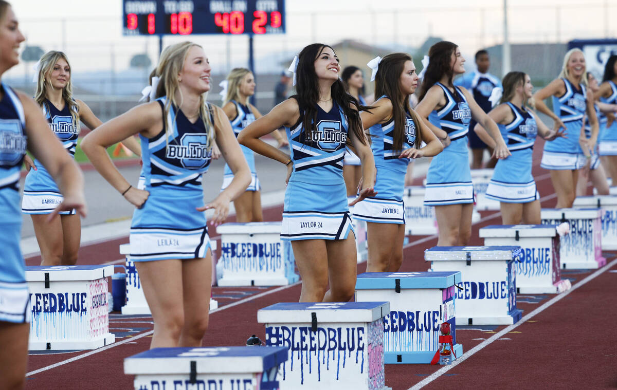 Centennial High School cheerleaders perform during the first half of a football game against Si ...