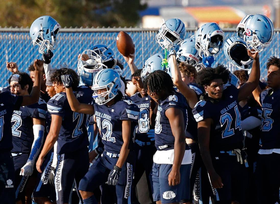 Centennial High School players gather before the first half of a football game against Silverad ...