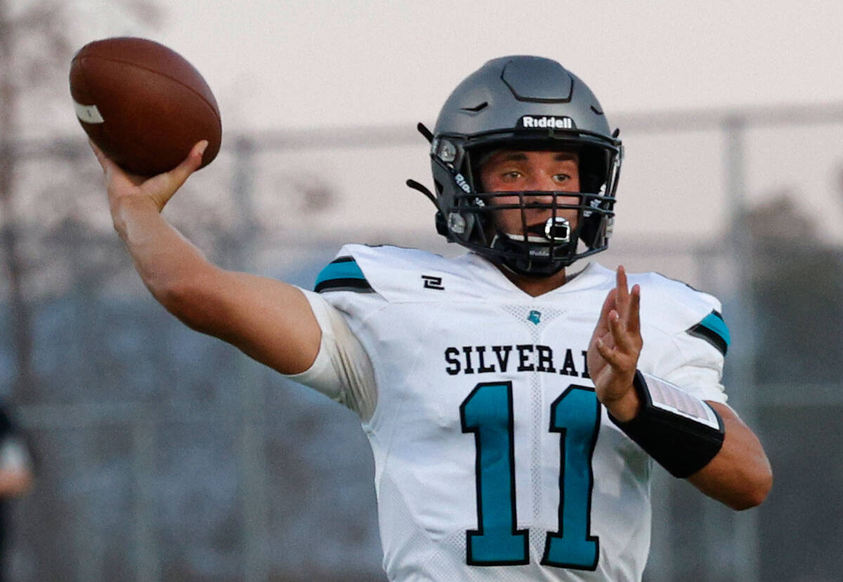 Silverado High School's quarterback Brandon Tunnell throws a ball during the first half of a fo ...