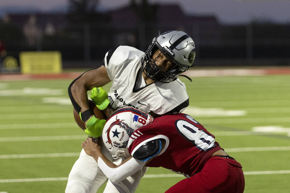 Liberty’s Colton Friedman (82) tackles Palo Verde’s Cedric Cade (10) during the s ...