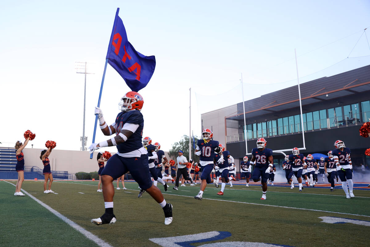 Bishop Gorman players take the field for a football game against Corner Canyon at Bishop Gorman ...