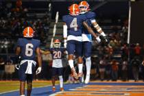 Bishop Gorman's Elijah Palmer (4) and Kodi Decambra (24) react after a missed catch opportunity ...