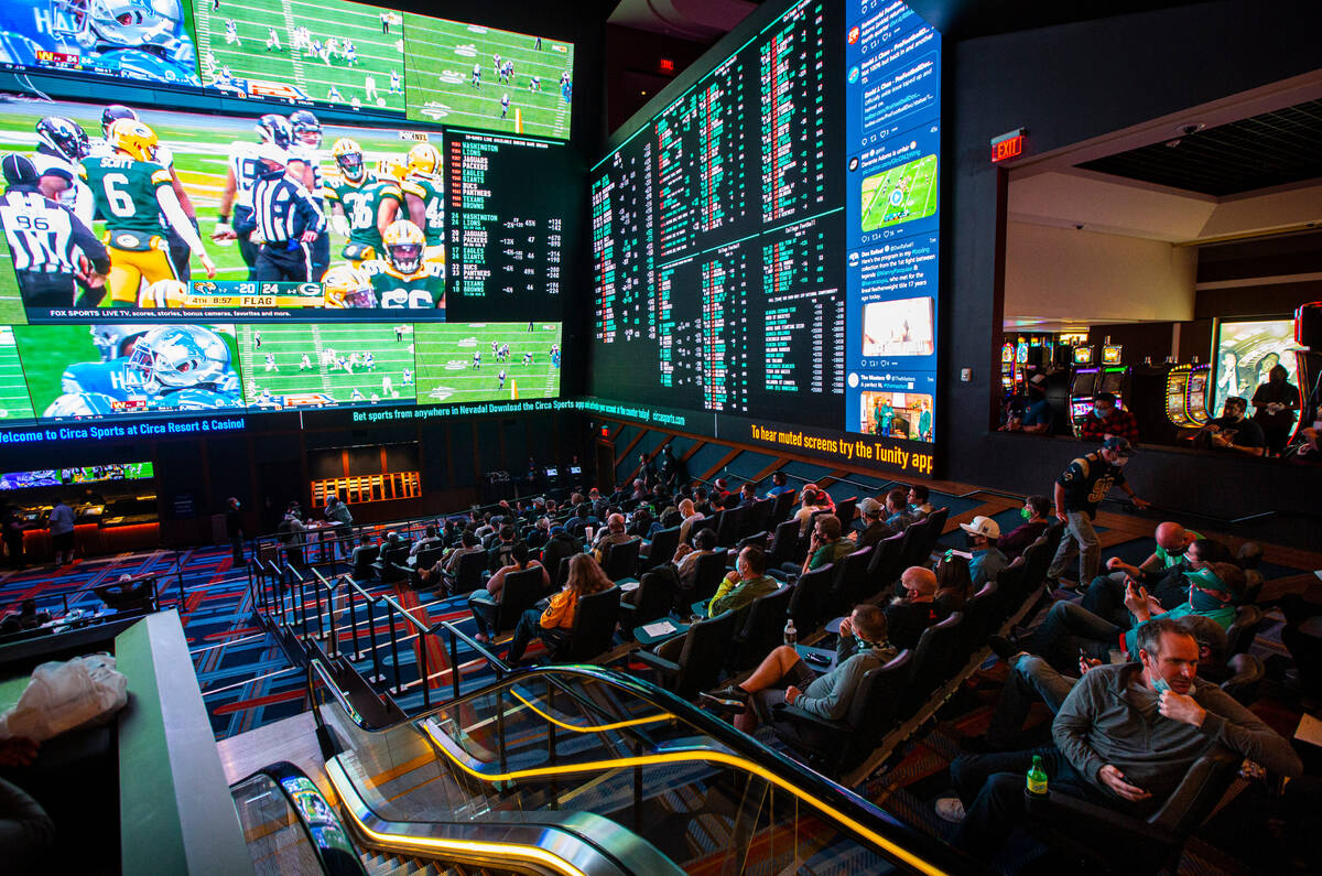 Football fans take in the action at the Circa Sportsbook as NFL games play across the 78-millio ...