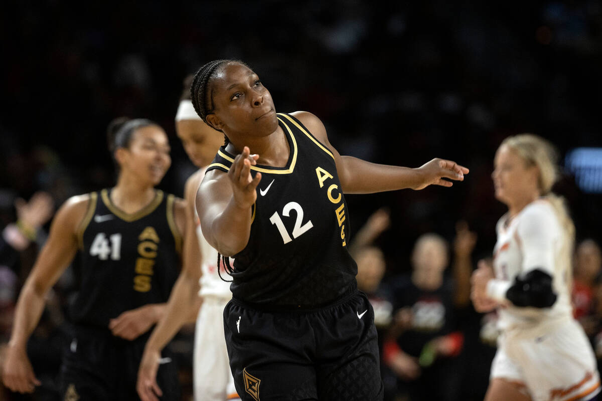 Las Vegas Aces guard Chelsea Gray (12) celebrates after scoring a 3-point shot during the secon ...