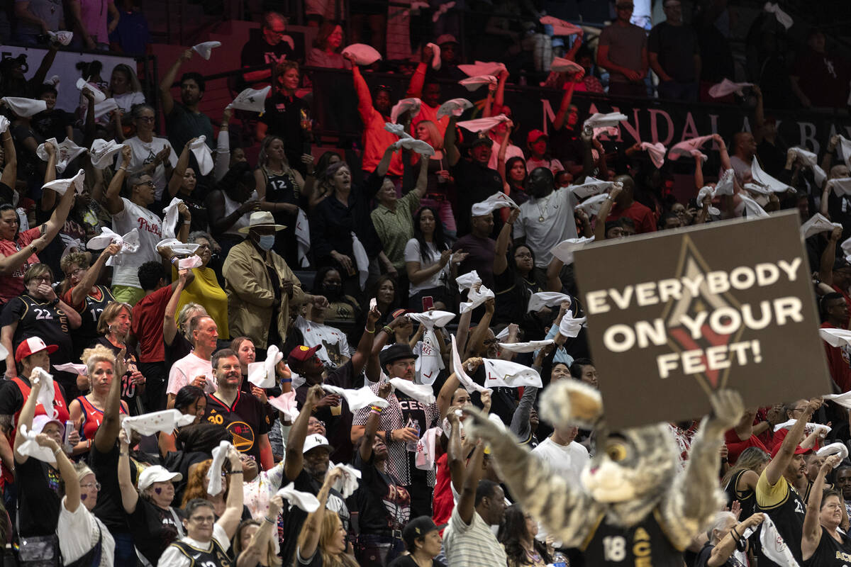 The Las Vegas Aces mascot asks the crowd to stand and cheer for their team during the second ha ...