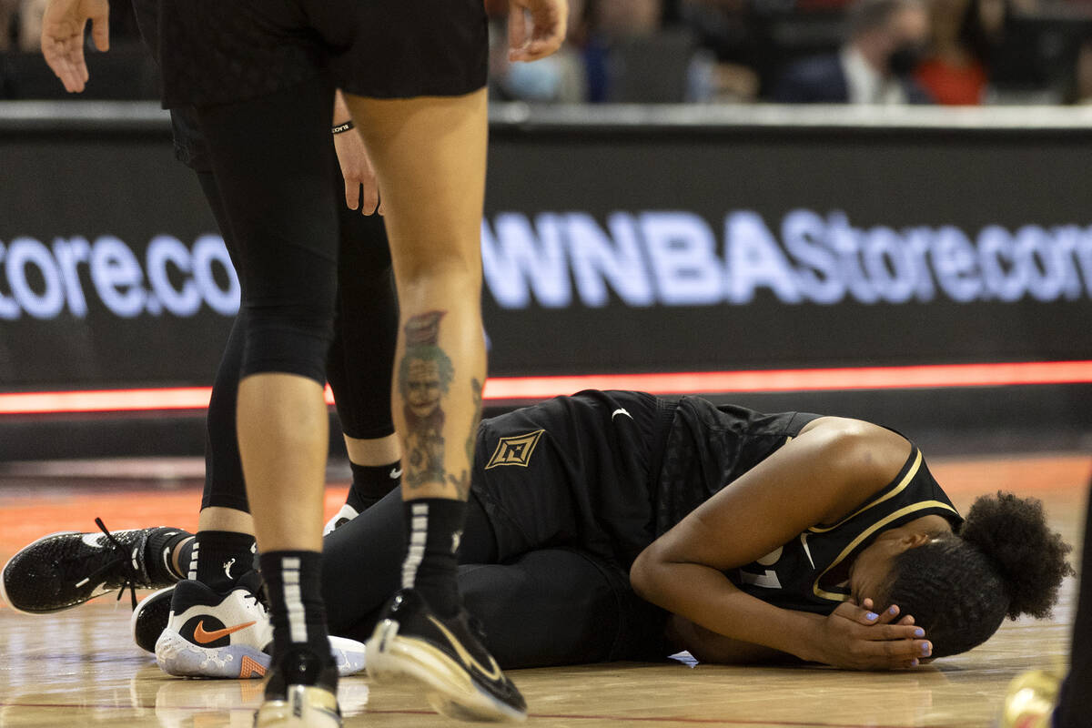 Las Vegas Aces center Iliana Rupert (21) falls to the floor in pain during the second half of a ...