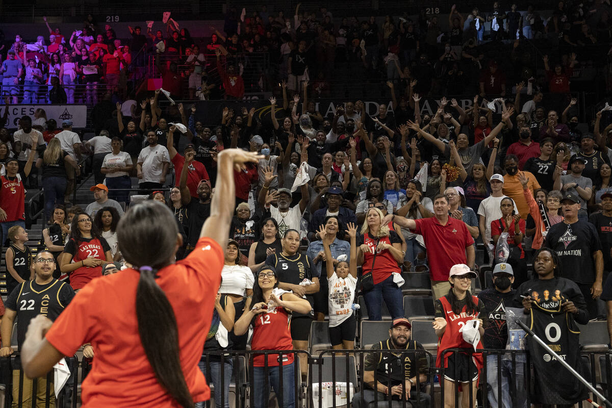 Las Vegas Aces guard Jackie Young throws a t-shirt into the crowd after winning a WNBA playoff ...