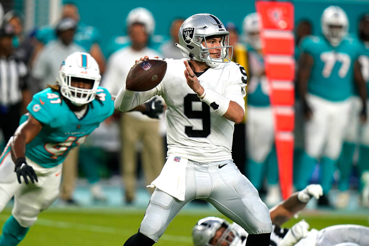 Las Vegas Raiders quarterback Nick Mullens (9) aims a pass during the first half of a NFL prese ...