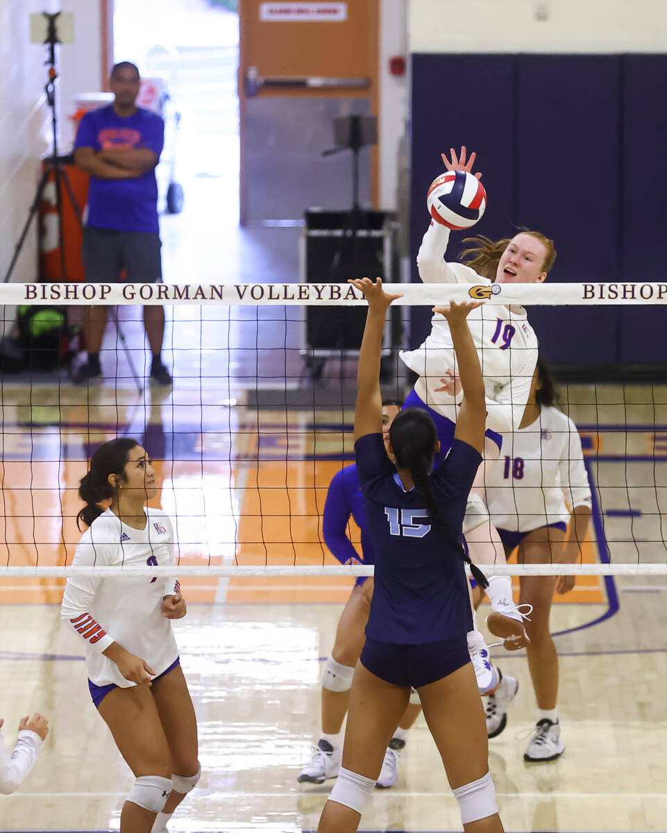 Bishop Gorman's Ashley Duckworth (19) hits the ball against Centennial during a volleyball game ...