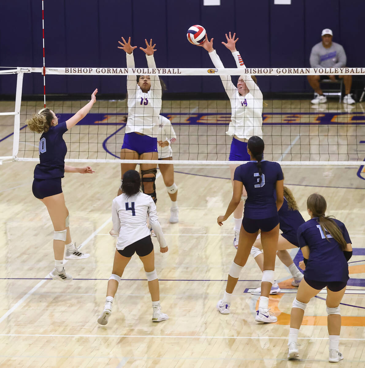 Bishop Gorman Ashley Duckworth (19) blocks a shot from Centennial during a volleyball game at B ...
