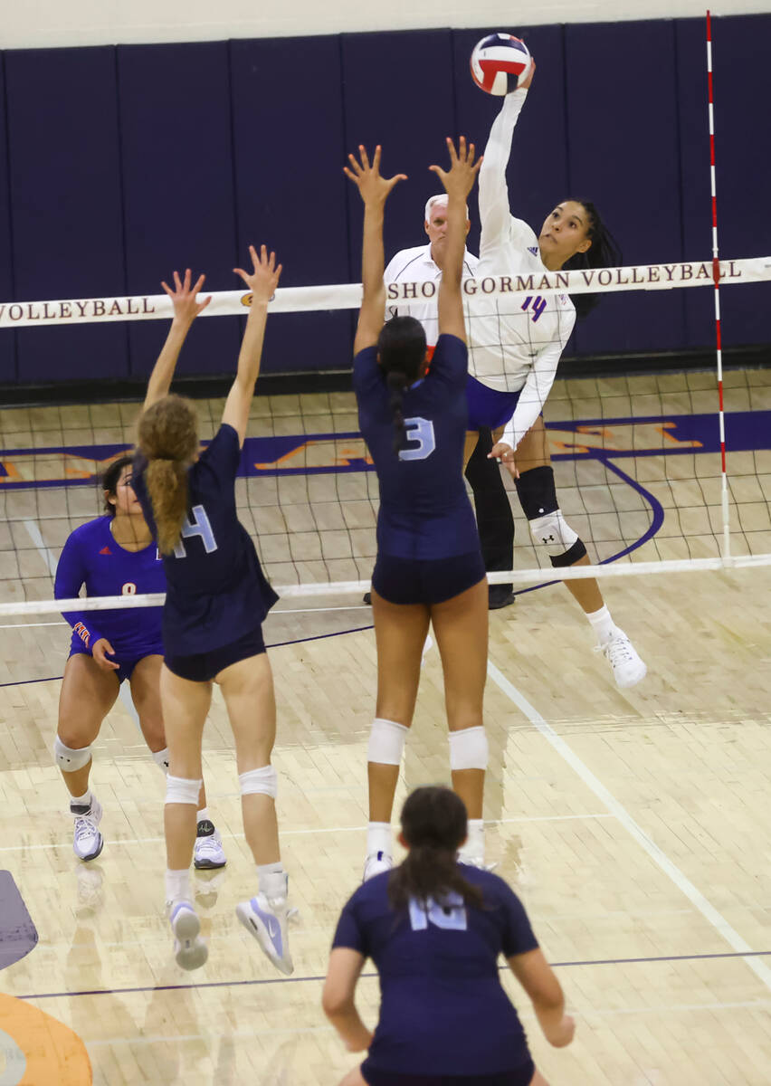 Bishop Gorman outside hitter Ayanna Watson (14) looks to spike the ball past Centennial's Charl ...