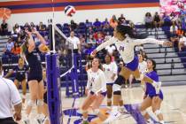 Bishop Gorman's Ayanna Watson (14) goes for a strike as Centennial's Abigail Vlaming (10) defen ...