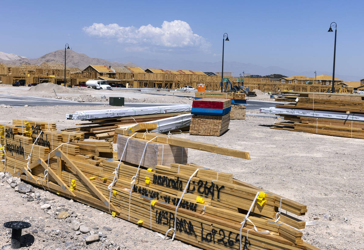 Building materials are seen where construction for a new housing community is underway along Vi ...