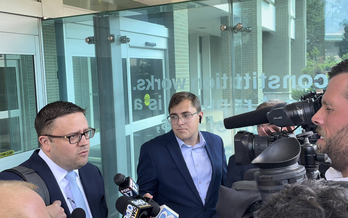Attorney Joshua Blanchard, left, representing Barry Croft Jr., speaks with the media outside th ...