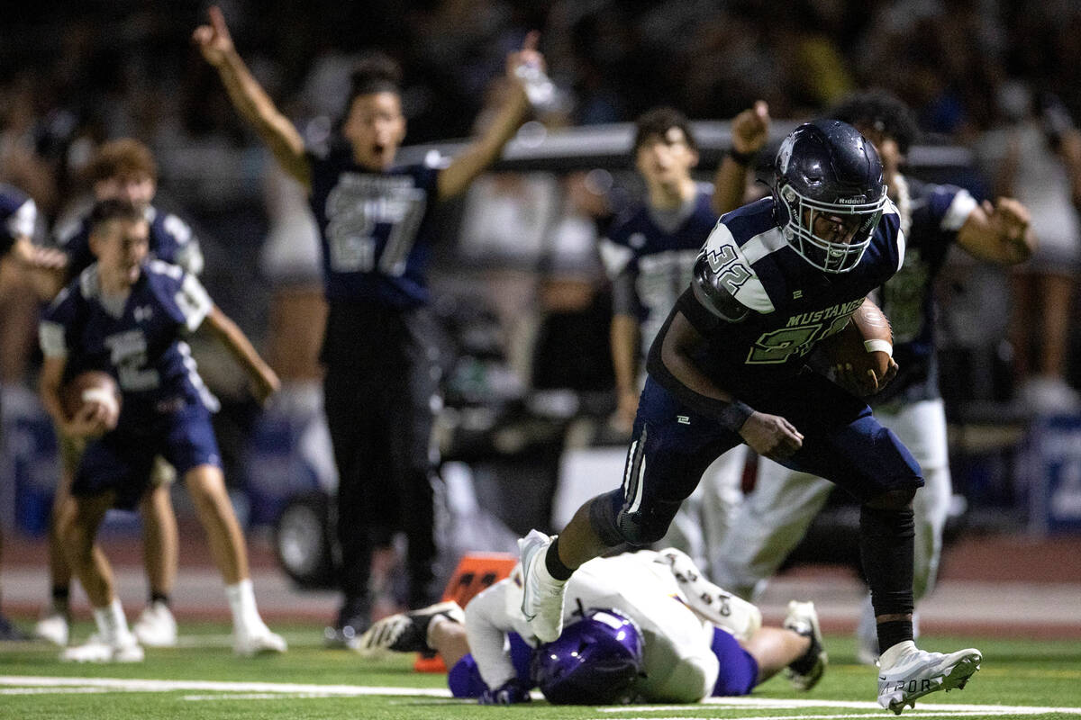 Shadow Ridge slotback Jon Wilson (32) reaches the end zone for a touchdown that was not counted ...