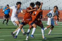 Eldorado striker David Figueroa (12) makes goal kick past Legacy forward Christian Nava (11) an ...