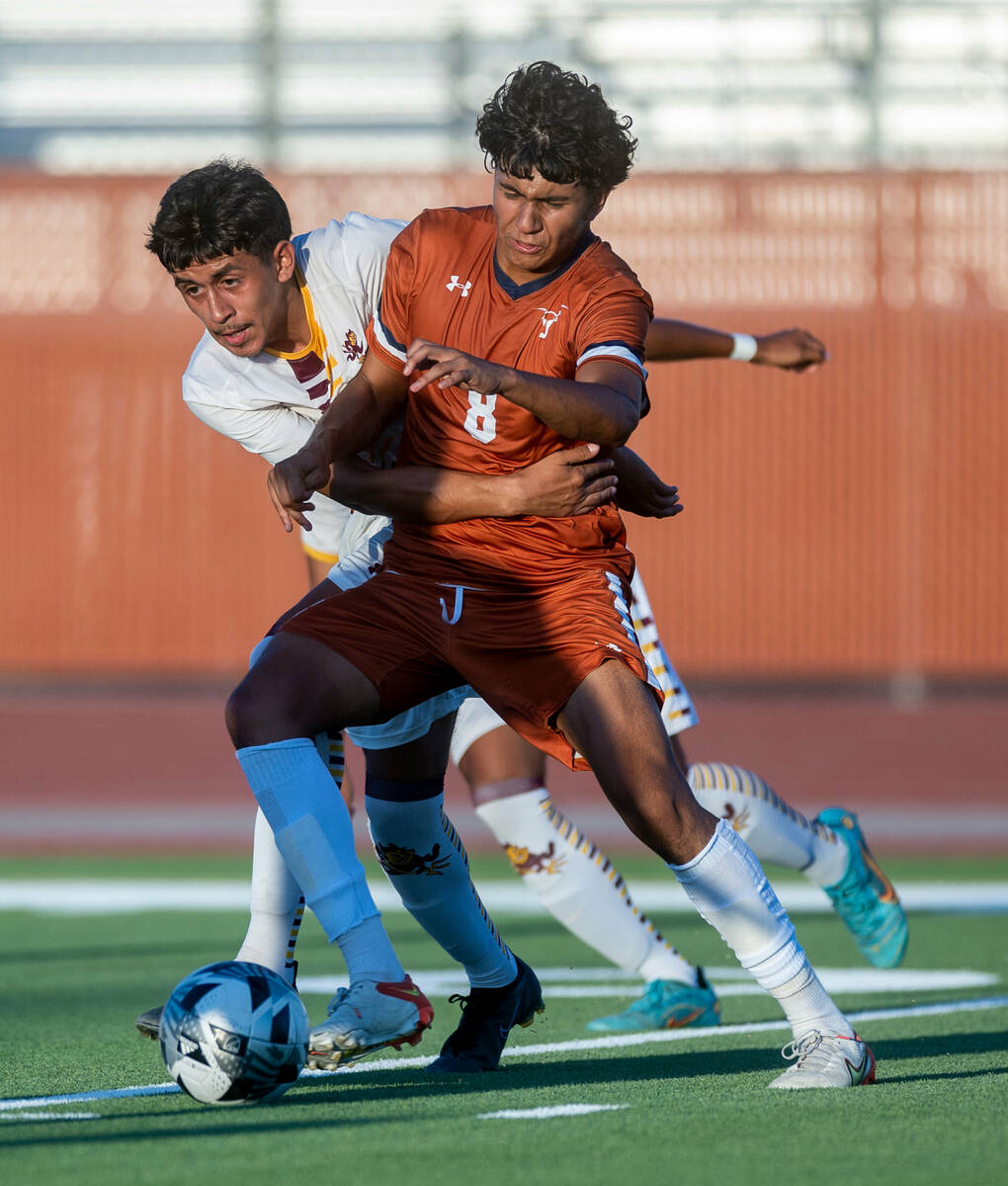 Eldorado defender Sebastian Puentes (4) fights to get around Legacy forward Santiago Barrios (8 ...