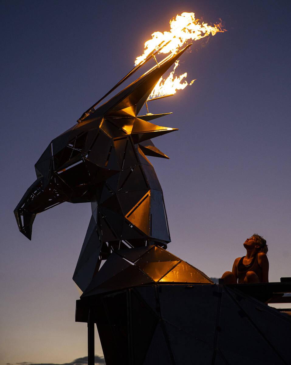 Christiane Yerex, flame effects technician, looks on at a test of the pyro as crew members work ...