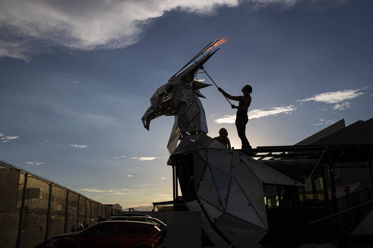 Crew members do a pyro test of The Metaphoenix art car, in preparation for Burning Man, at a wa ...