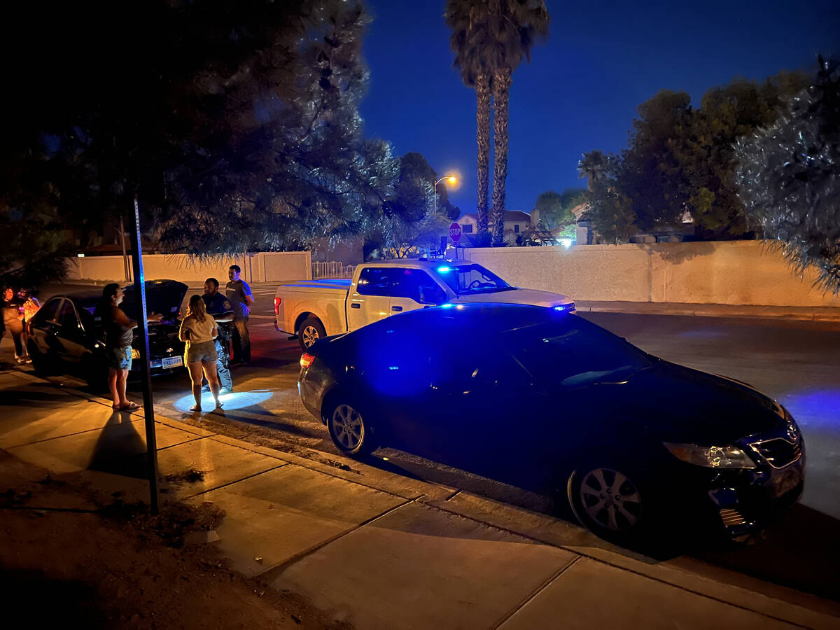 North Las Vegas Police Officer Andy Navarro investigates a crash at San Miguel Avenue and Colem ...