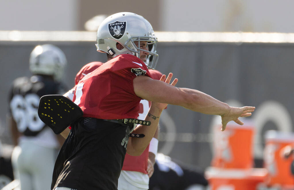Raiders quarterback Derek Carr (4) throws the football during the team’s training camp p ...
