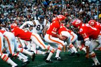 FILE - Kansas City Chiefs quarterback Len Dawson (16) turns around to hand the ball off to runn ...