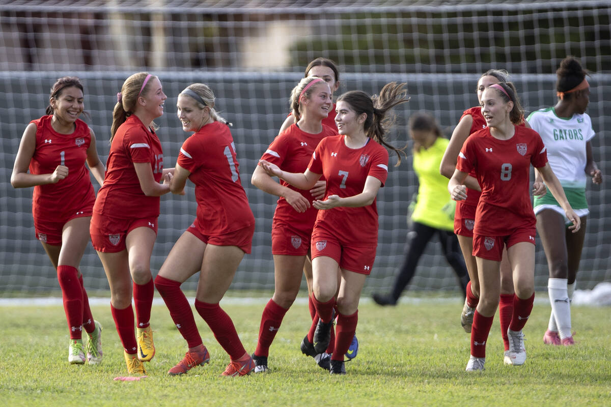 Arbor View players celebrate after their team scored a goal during a girls high school soccer g ...