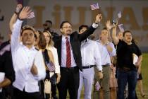 About 700 people become U.S. citizens during a naturalization ceremony at halftime of the Las V ...