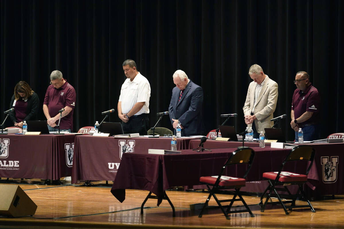 Dr. Hal Harrell, center, and members of the Board of Trustees of Uvalde Consolidated Independen ...