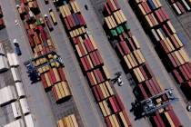 Shipping containers are stacked together at the Port of Baltimore, Friday, Aug. 12, 2022, in Ba ...