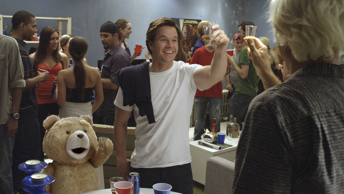 John, played by Mark Wahlberg, and his best friend, Ted, voiced by Seth MacFarlane, do rum shot ...