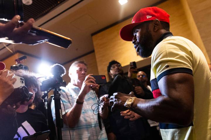 Floyd Mayweather talks with reporters after announcing an exhibition boxing match, that he is s ...