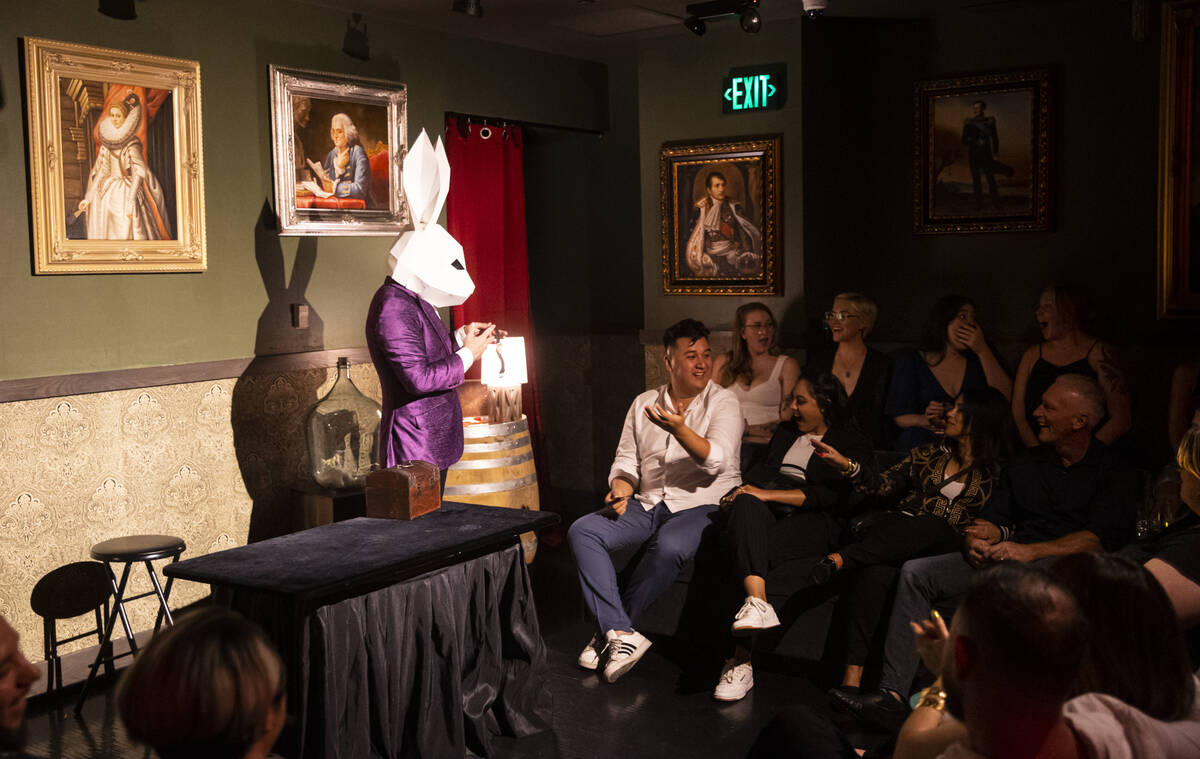 The Magician, of The Magician's Study, shows the watch he took off of audience member Carlos Ri ...