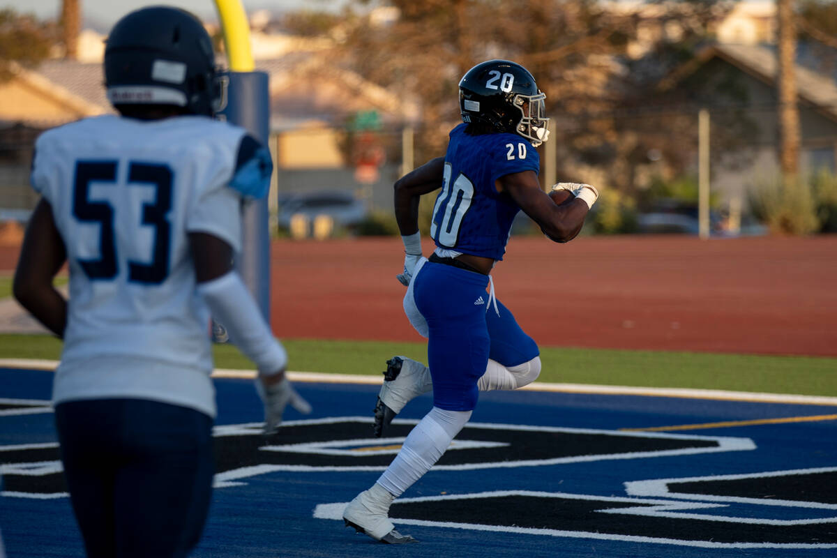 Desert Pines junior Isaiah Rubin (20) returns a punt for a touchdown during the first half of t ...